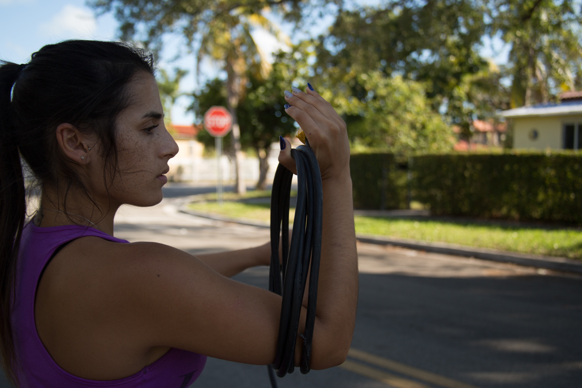 girl wrapping a cable