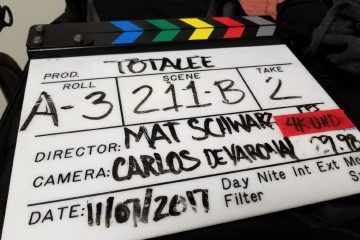 a film slate being used on a video shoot