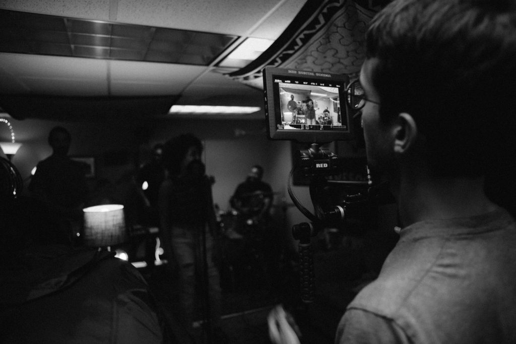 man operating a camera